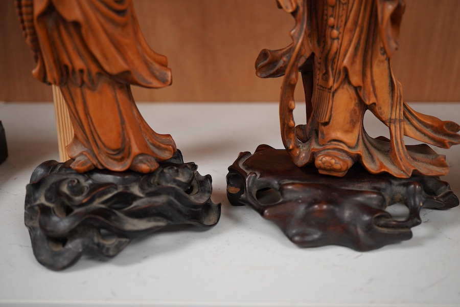 Two Chinese carved boxwood figures, one of Shao Lao, the other of Guan Yin, both on stands, on stands. tallest 26cm